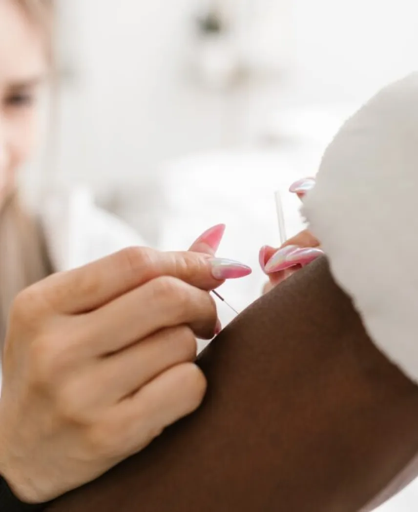 Dry needling treatment on a patient’s shoulder