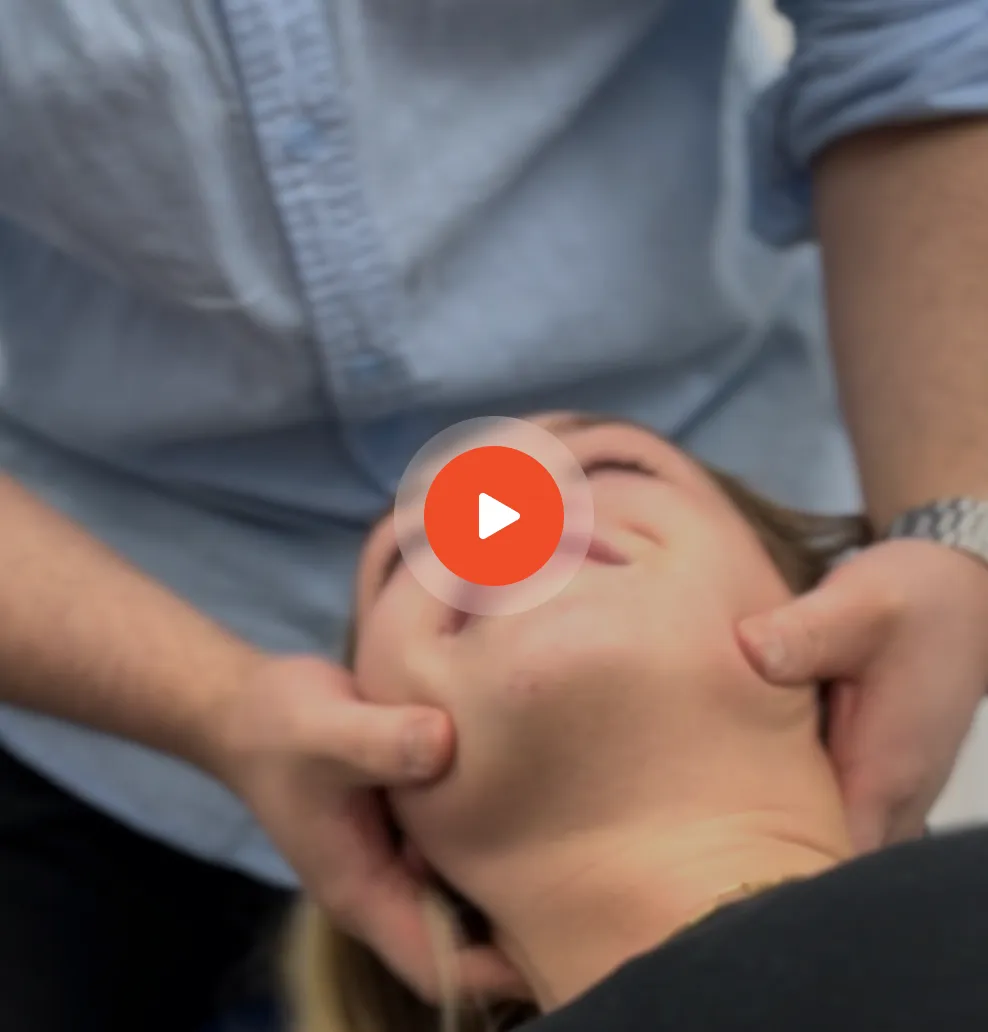 Patient receiving neck treatment for headaches
