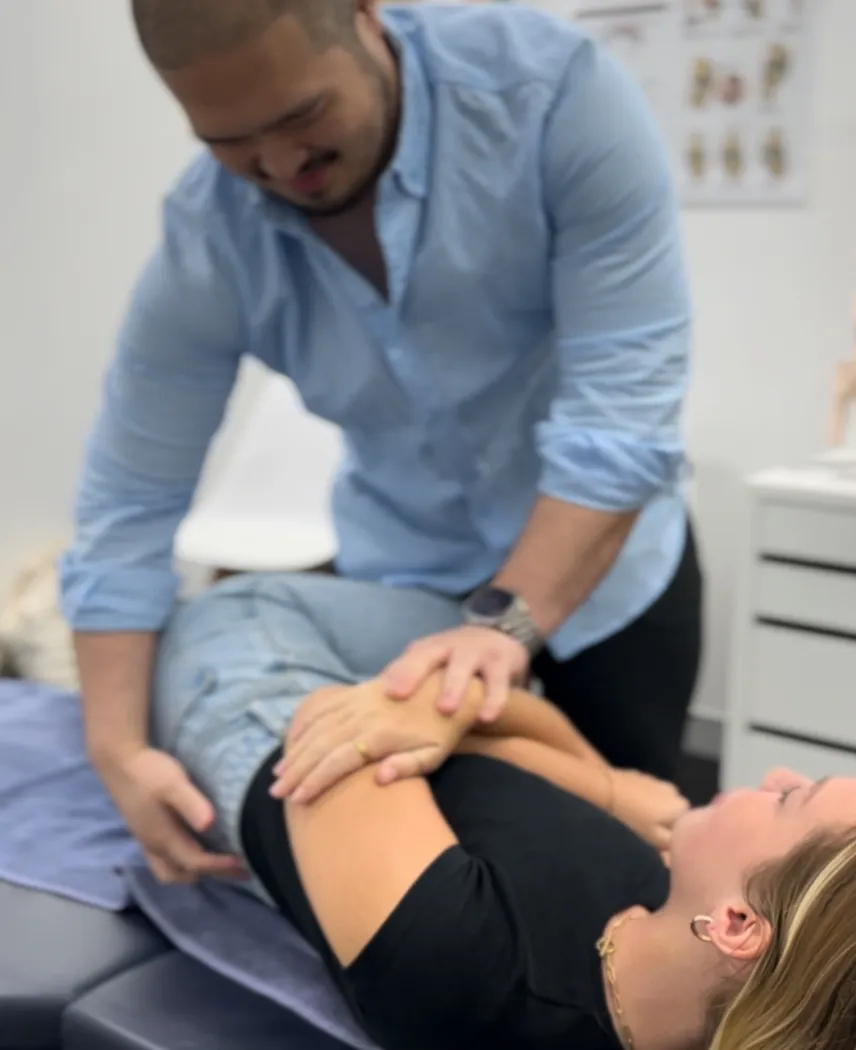 Chiropractor performing a spinal adjustment