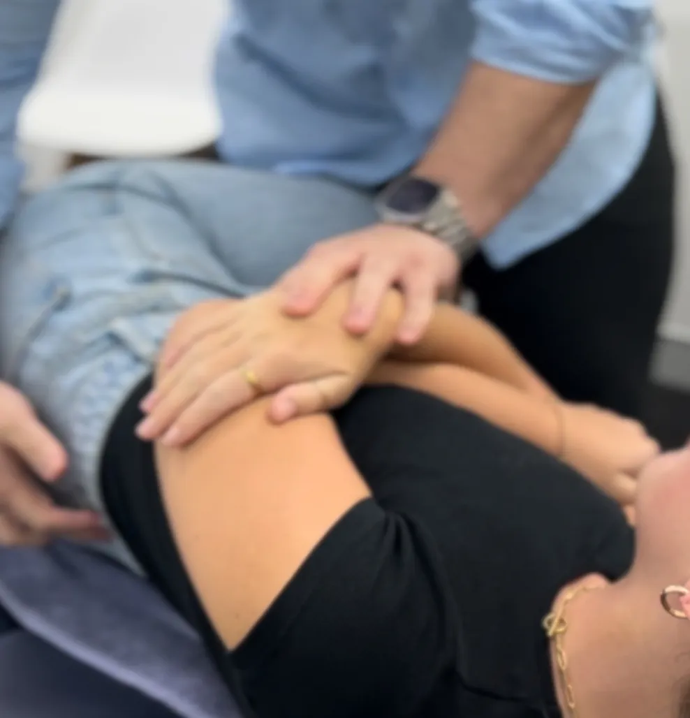 Patient being assessed for lower back pain