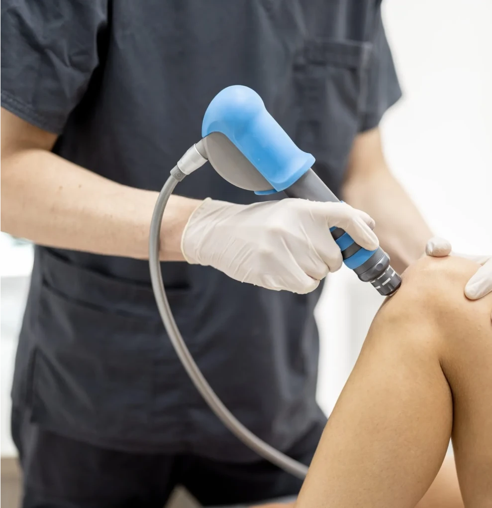Shockwave therapy applied to a patient’s back